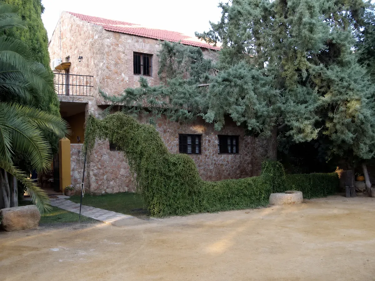 The main house and entrance courtyard at Sierra Recovery, a restored cortijo near Malaga.